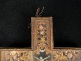 a cross with a picture of jesus on it on a black background