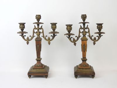 pair of antique brass candelabs on wooden bases