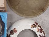 a bowl, a bowl, and a bowl on the floor