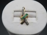a close up of a ring with a cross on it