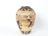 a vase with a picture of a man and a woman on it