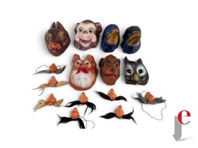 a lot of masks that are sitting on a white surface