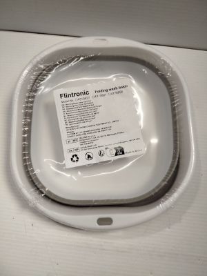 une photo de toilettes blanches avec un couvercle en plastique