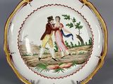 une assiette avec la photo d'un homme et d'une femme