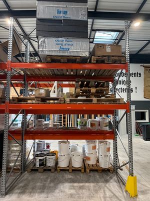 a large rack with many items on it in a warehouse