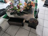 a table with flowers on it in the middle of a room
