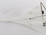 a small model of a plane on a white surface