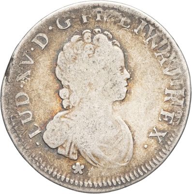 gros plan d'une pièce de monnaie sur laquelle figure une tête de femme
