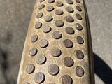 a close up of a bicycle tire on the ground