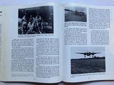 an open book with pictures of people and planes on it