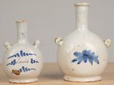 two vases that are sitting on a table