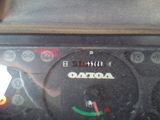 a close up of a car dashboard with a clock on it