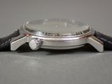an image of a close up of a watch on a table