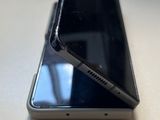 a close up of a cell phone on a table