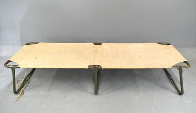 an old wooden table with metal legs and a wooden top