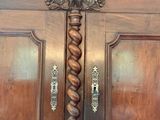 a large wooden door with a decorative handle on it