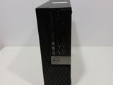 a dell desktop computer sitting on top of a white table