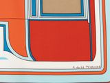 an orange and blue scarf with a square design on it