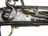 a close up of a gun that is on a white background