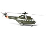 a helicopter that is sitting on the ground on a white surface