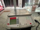 an image of a scale on a table in a room