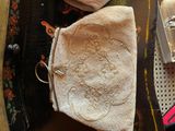 a purse that is sitting on a table next to a pair of shoes