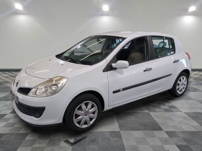 a picture of a white car parked in a garage