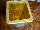 a small wooden box on a table with a price tag on it
