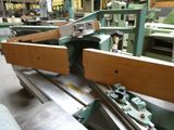 a picture of a machine that is working on a piece of wood