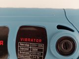 a close up of a blue electric driller on a white surface