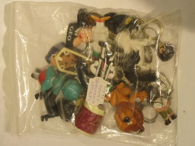 a bag of assorted toys in it on a table