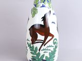 a white vase with a picture of a horse on it