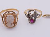 three rings with a lady ' s face and a lady ' s head on them