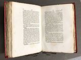 an open book that is sitting on a table