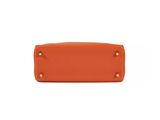 a small orange purse on a white background