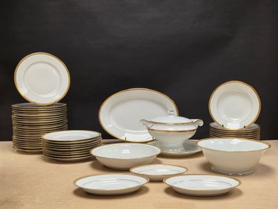 a lot of plates and bowls on the table