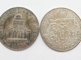 two silver coins with a picture of a building on them