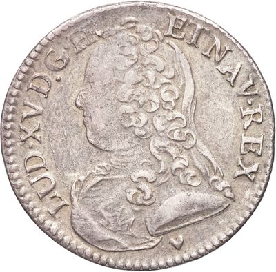 une pièce en argent portant le portrait d'un homme