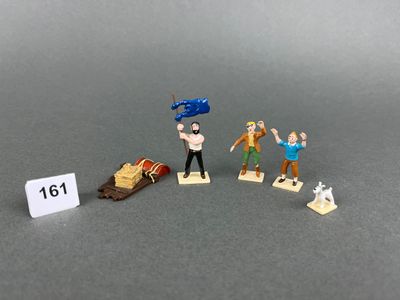 a lot of miniature figurines that are on a table