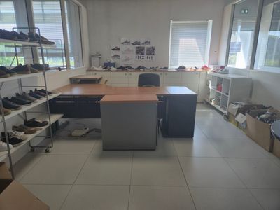 a picture of a room with a lot of shoes on the floor
