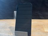 a cell phone that is sitting on a wooden table