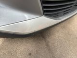 a close up of the front bumper of a car