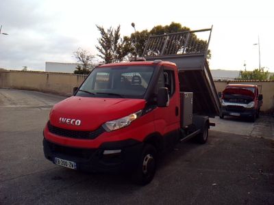a red truck parked in a parking lot with a solar panel on top of it