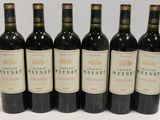 six bottles of wine are lined up in a row on a table