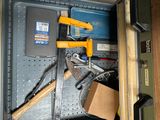 a toolbox with tools and a box with a hammer in it