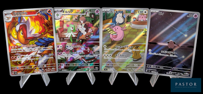 cinq cartes Pokémon différentes alignées sur un fond noir