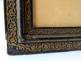 a picture of a picture of a black and gold frame