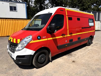 an image of a red and yellow ambulance parked in a parking lot