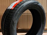 tires are stacked on a cardboard box in front of a cardboard box