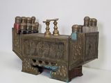 a metal box that has a bunch of bottles on top of it